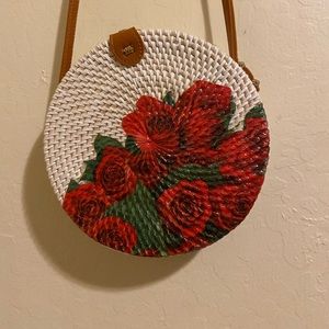 Handwoven circle rattan bag with a Rose Design